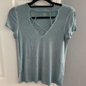 Light blue t-shirt with detail on neck line